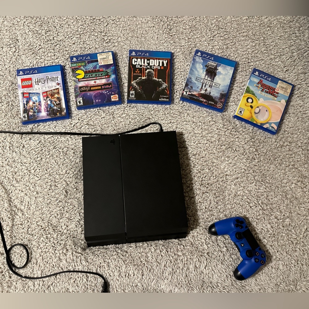 Play Station 4 with controller and 5 games